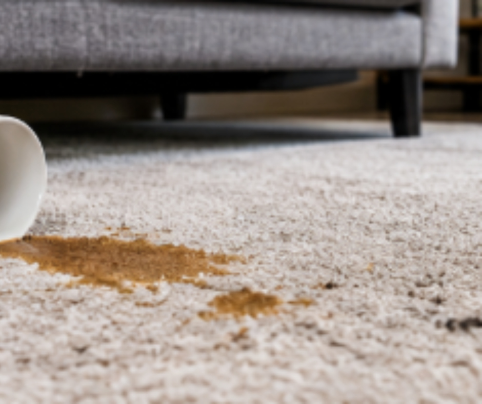 Stained carpet with coffee spill and dirt marks in a Melbourne home, showing the need for professional carpet cleaning services